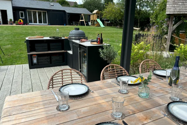 outdoor kitchen in Kelvedon with outdoor eating area on decking in large garden