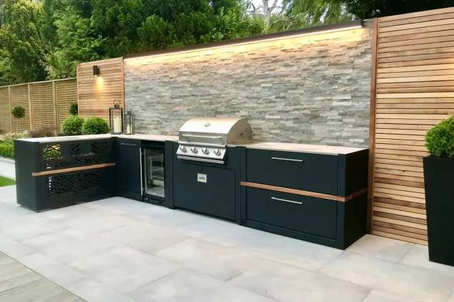 Outdoor kitchen in Keston Kent on decking with bull bbq and fridge
