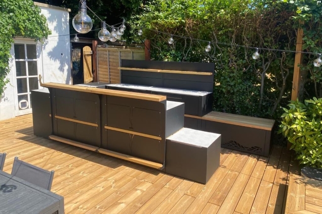 Outdoor kitchen in bristol on wooden decking with bar cabinets