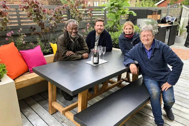 Outdoor kitchen on ITV series with alan titchmarsh sitting on bench