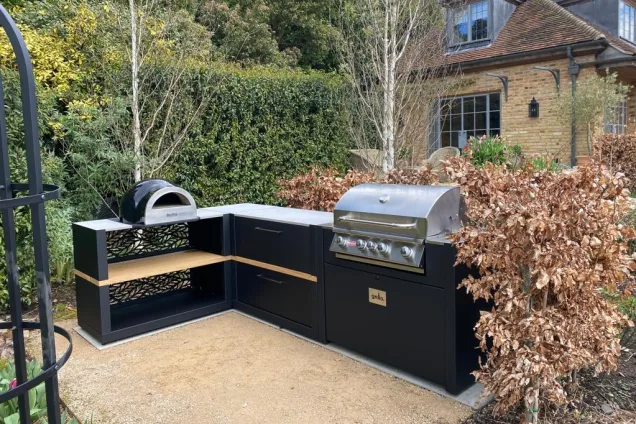 Outdoor kitchen in Surrey with Pizza oven and Gas BBQ on hardcore