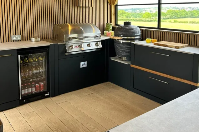 Outdoor kitchen in Hertfordshire with Gas BBQ, Gusto BBQ and fridge cabinet and storage units