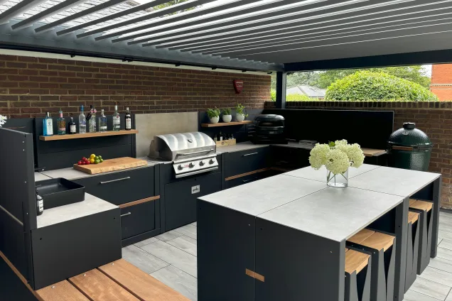 Outdoor kitchen in Hertfordshire with Gas BBQ and worktop space and pizza oven