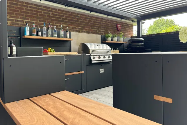 Outdoor kitchen in Hertfordshire with Gas BBQ with feature walls