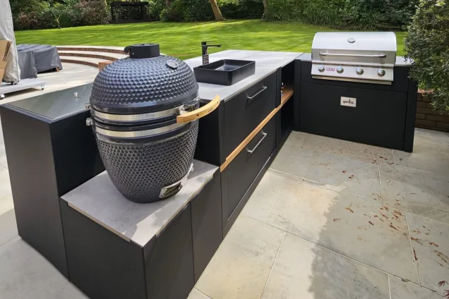 Outdoor kitchen in Weybridge with Gas BBQ, Charcoal bbq and sink on patio