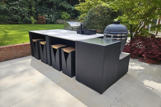 Outdoor kitchen in Weybridge with Gas BBQ, Charcoal bbq, sink and bar stools