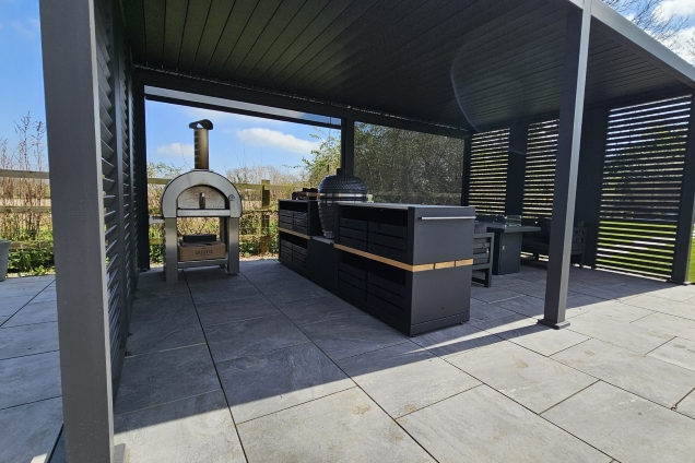 Outdoor Kitchen in Hathern with seating area on patio with charcoal bbq and pizza oven