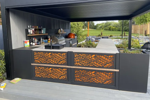 Outdoor kitchen in Bedfordshire with Bull BBQ and sink and storage cabinets
