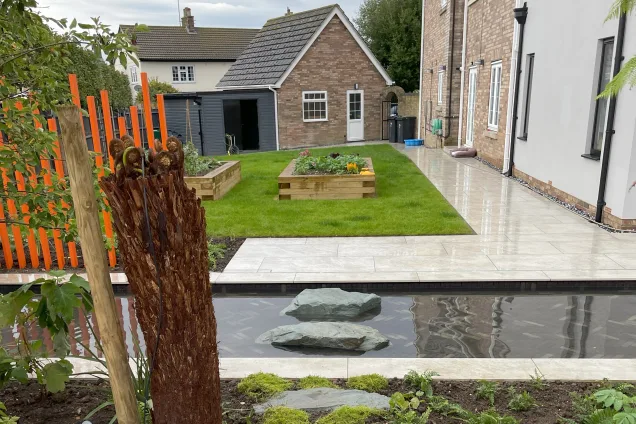 Outdoor kitchen in Bedfordshire with growbeds in the garden
