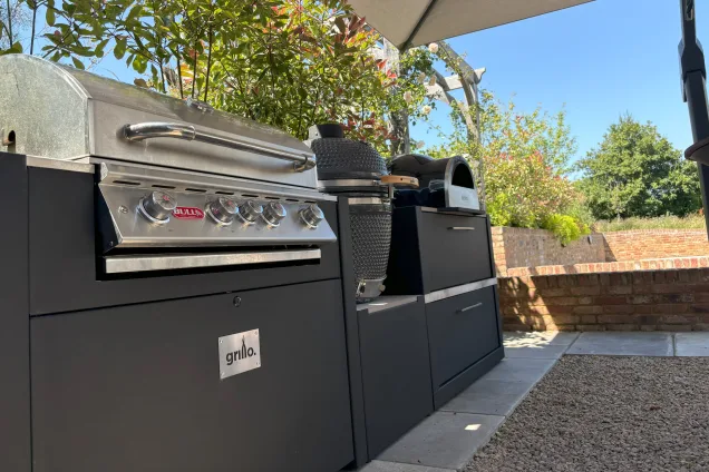 Outdoor kitchen in saffron walden under canopy with Gas bbq, Gusto charcoal bbq and pizza oven