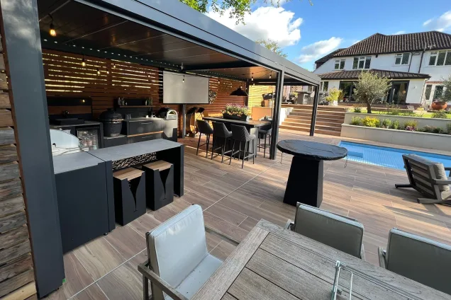 outdoor kitchen under cover next to outdoor pool