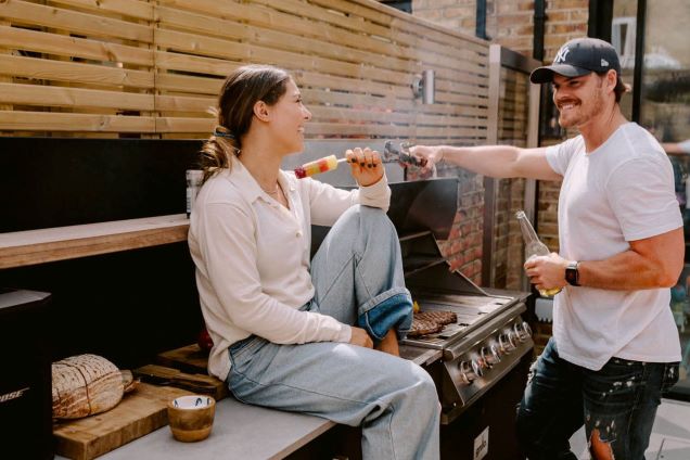 people having a bbq on grillo outdoor kitchen