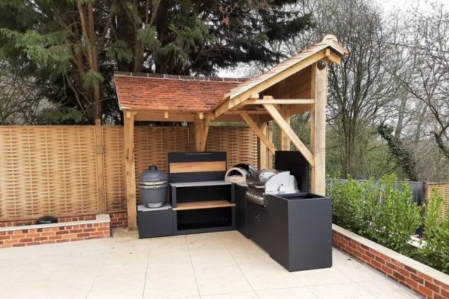 outdoor kitchen with BBQs and pizza oven in Warley, Brentwood