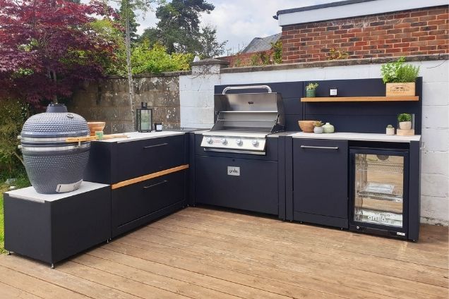 L-shaped outdoor kitchen on wooden patio in Reigate, Surrey