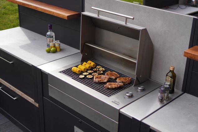 voltiq electric bbq with lid open and food cooking on the grills