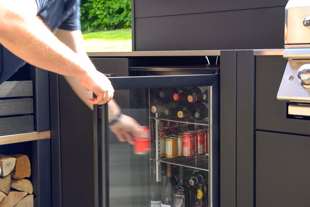 person taking drink from drinks fridge