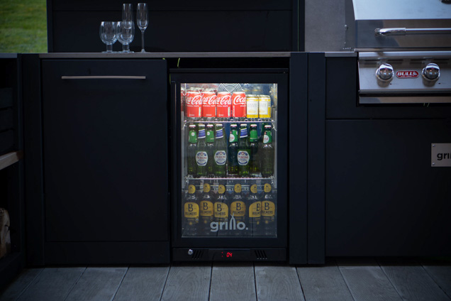 drinks fridge with light on at dusk