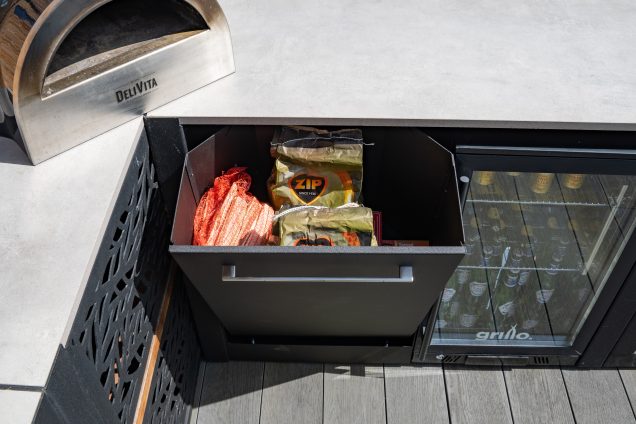 bbq accessories being stored in bin