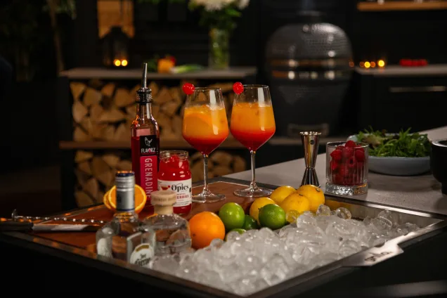 Drinks station with poured drinks and ice.