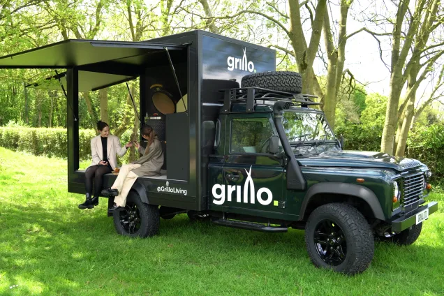 people sitting in the grill rover in garden