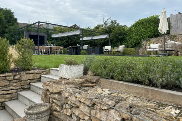 Grillo kitchen on paito under pergola in garden