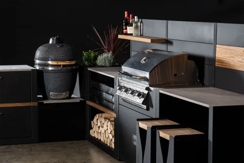 Outdoor kitchen with gusto charcoal bbq and gas bbq station in studo