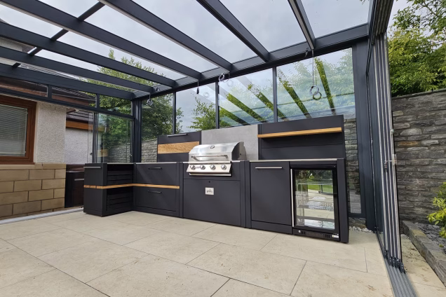 Outdoor Kitchen on patio in Stewarton, Ayrshire under glass pergola next to house