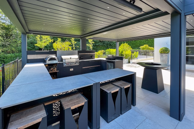 Outdoor kitchen in Runnymede, Surrey with large u shaped outdoor kitchen in large estate garden
