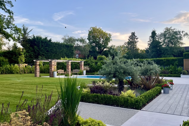 large garden with patio and landscaped plants