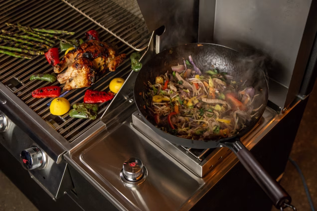 wok on bull sideburner and veg on grill station