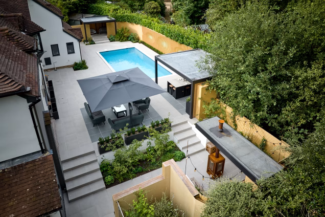 Drone photo of the side garden of a large house in Ashtead, Surrey, landscaped by PC Landscapes