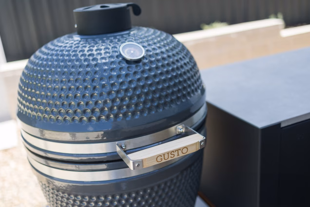 Closeup detail photo of the wooden handle of a Grillo Gusto kamado barbeque in Old Toongabbie