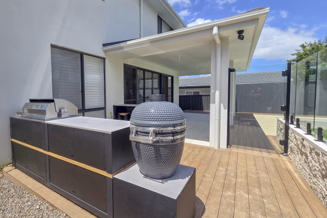 Rear view of an outdoor kitchen demonstrating the thought put into the design to ensure the kitchen looks good from all angles