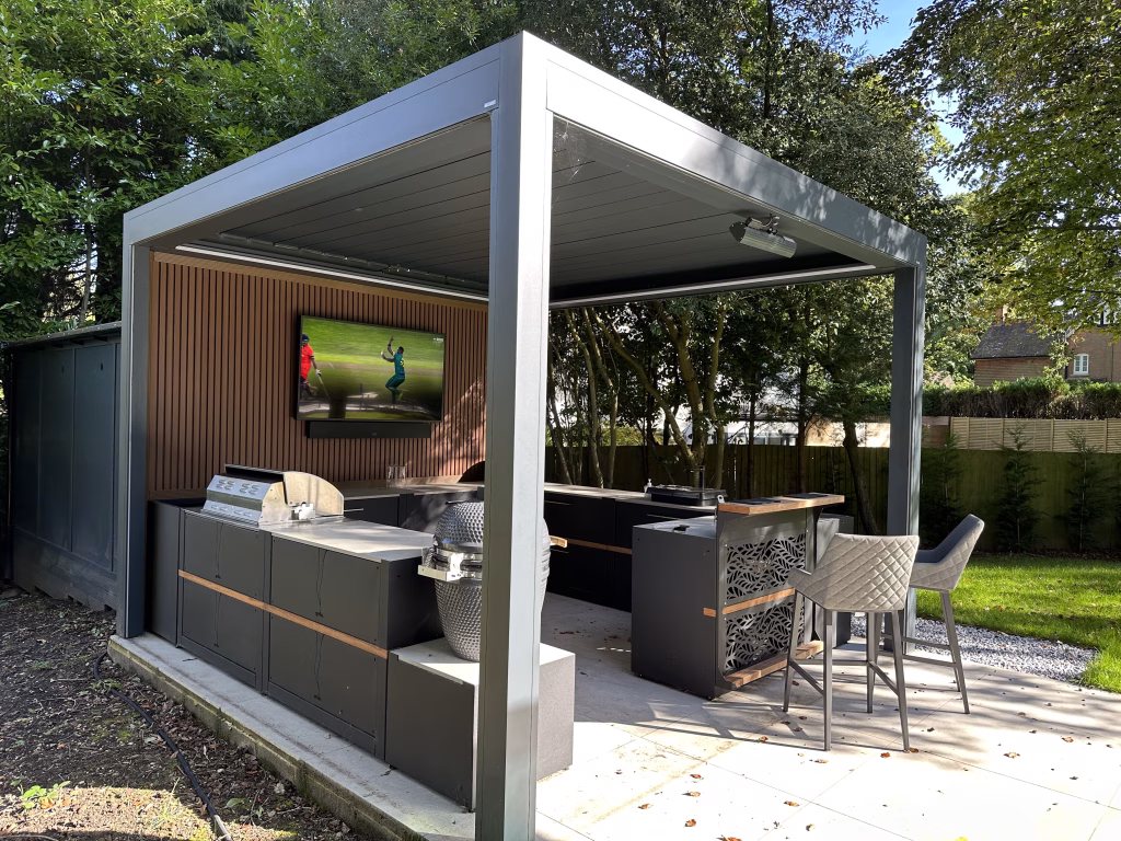 outdoor kitchen with gas and charcoal bbqs and storage cabinets