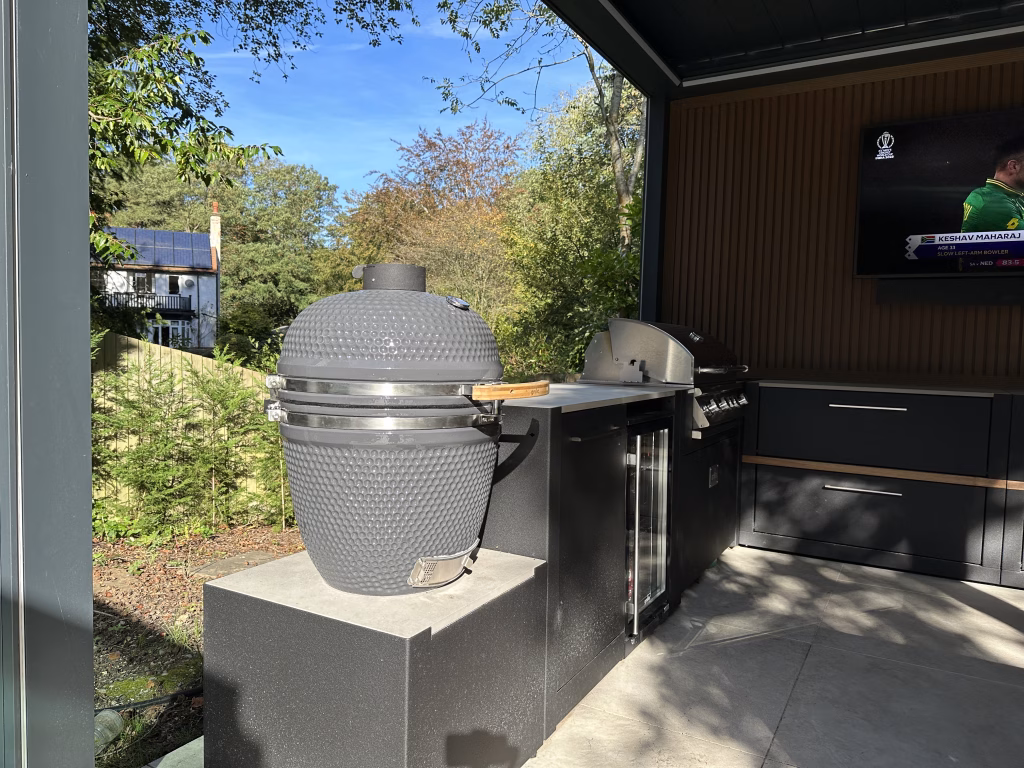 storage units on patio with sink and pizza oven on them