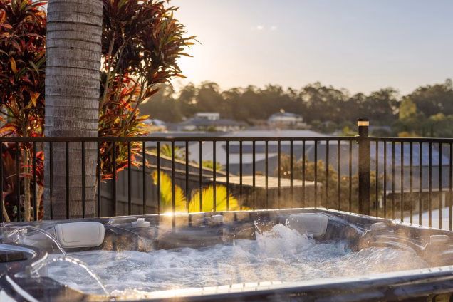 hot tub with jets going in terraced garden