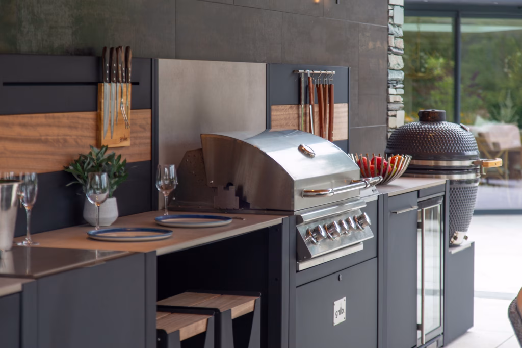 outdoor kitchen at Town head Estate with gusto charcoal bbq and bull gas grill station