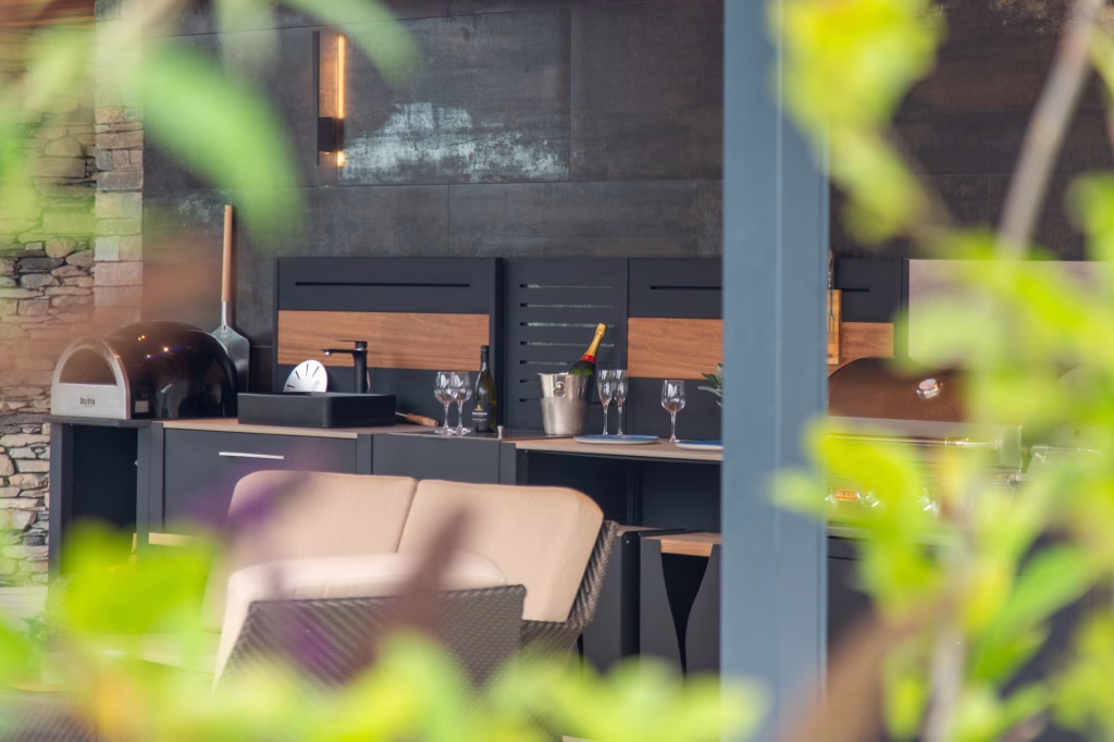 close up of pizza oven and sink in grillo outdoor kitchen