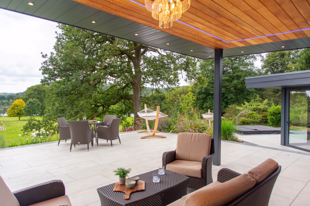 view from under large covering out into patio and garden