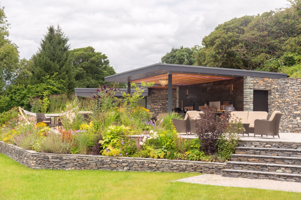 large outdoor covering and patio with seating and outdoor kitchen