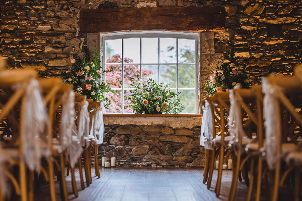town head estate barn with tables and chairs and flower arrangements