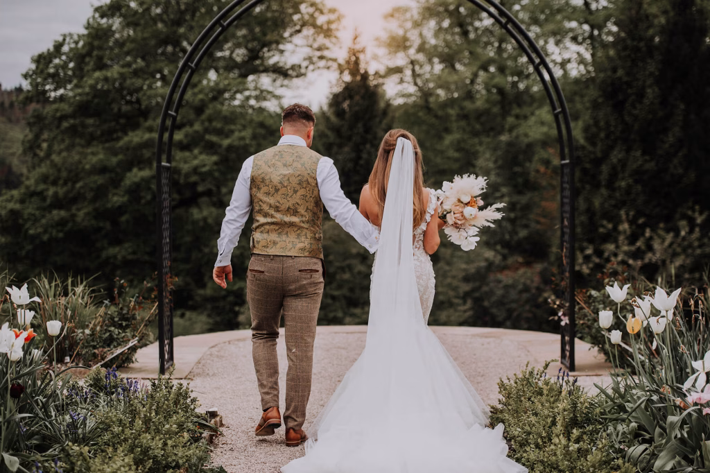 people at marriage walking down path
