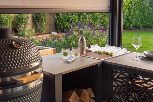 The Grillo Drinks Station and Gusto with a view across the grassy garden in the background