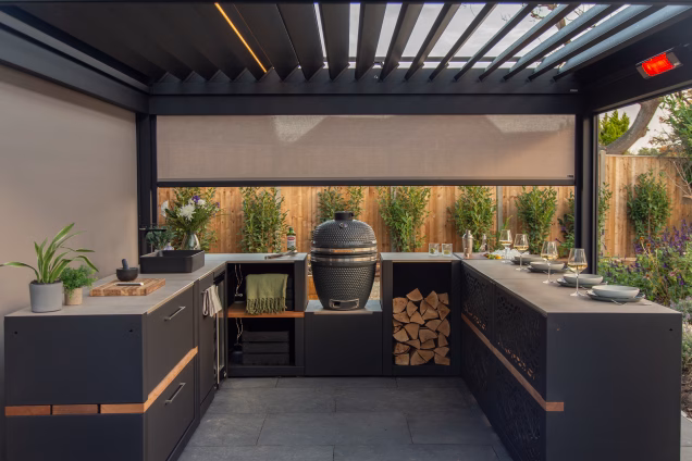A U-shaped Grillo outdoor kitchen under a pergola featuring the Gusto BBQ, sink and fridge