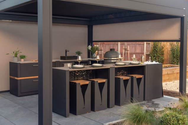 Looking into a Grillo pergola at a Grillo bar table with matching bar stools