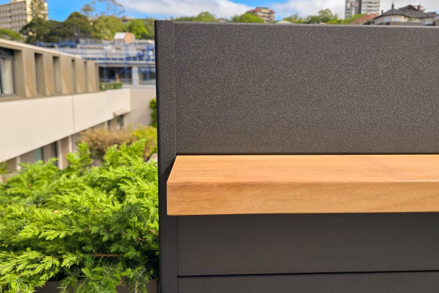 A detailed photo of the solid iroko feature wall shelf on a Grillo outdoor kitchen on a roof terrace in Double Bay