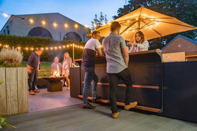 people standing at grillo standing bar cabinet