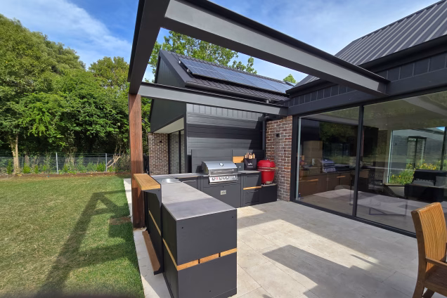 An L-shaped Grillo outdoor kitchen in a contemporary alfresco area in Moss Vale, featuring a rare standing bar - unique to Grillo