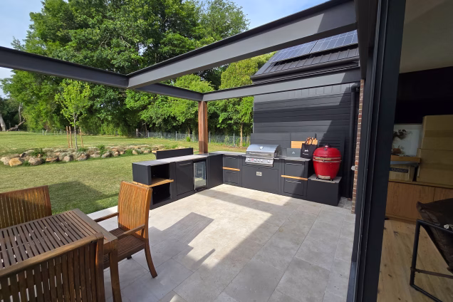 Looking out the patio doors of a garden in Moss Vale NSW, where a Grillo outdoor kitchen is on the alfresco