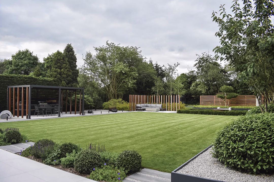 large garden with seating area, outdoor kitchen and plush lawn